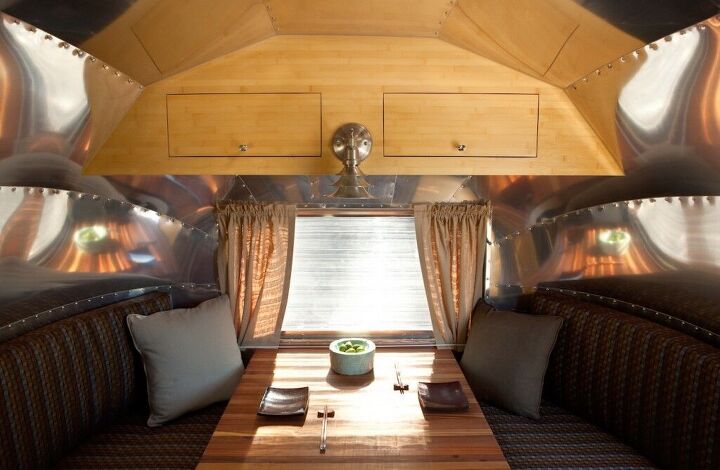 beautiful and green runaround sue 1961 vintage airstream safari renovation, Dining area of renovated vintage Airstream The tabletop folds down to form a bed
