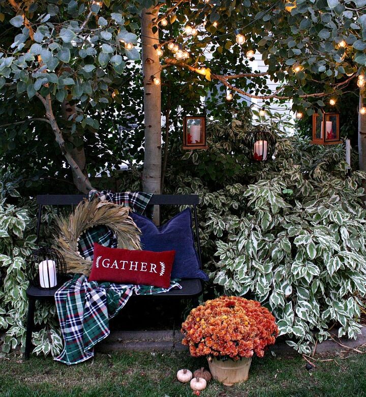 creative backyard landscaping ideas on a budget, In the Fall I love to string my outdoor cafe lights from JOANNS in our aspen trees