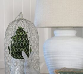 simple and thrifty spring decor ideas, thrifted books concrete bunny and wire cloche