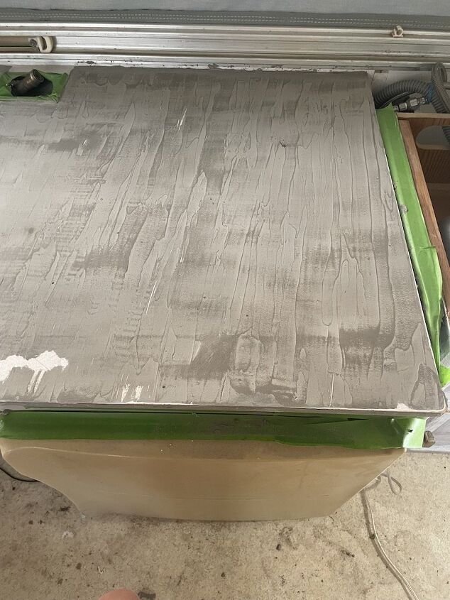 how to create faux diy concrete countertops, EXAMPLE Here is the countertop after the first coat and the first round of sanding Your goal with subsequent coats is to even everything out so only minimal sanding is necessary