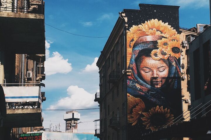 this ukrainian micro apartment design has taken on new meaning, Sunflower mural in Kyiv Ukraine