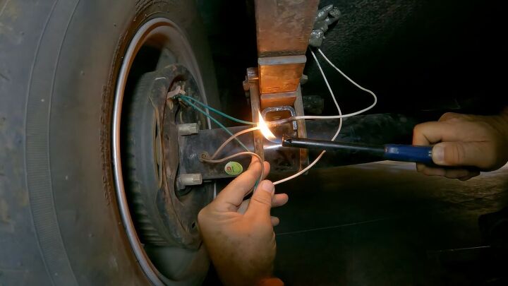 how to fix broken trailer brake wiring a step by step guide, Using a lighter to shrink the butt connector