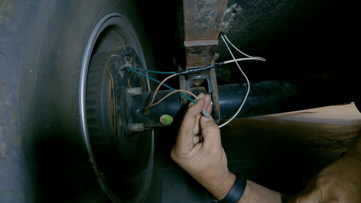 how to fix broken trailer brake wiring a step by step guide, Wrapping the butt connector in black electrical tape