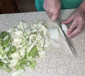 a cheap easy cabbage pasta recipe inspired by the great depression, Cutting up the onion