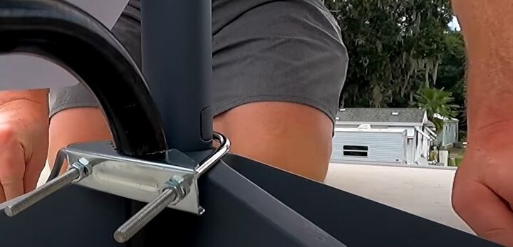 how to install starlink internet for rvs in a few simple steps, Clamping the base to the RV ladder