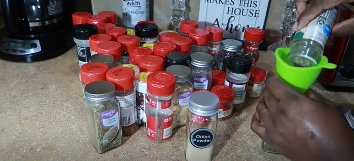 how to make or upgrade a diy spice drawer organizer, Filling up jars with spices