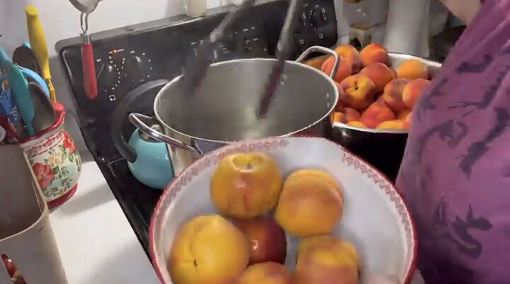 want to save the summer s peaches try this easy peach canning recipe, Boiling and blanching the peaches