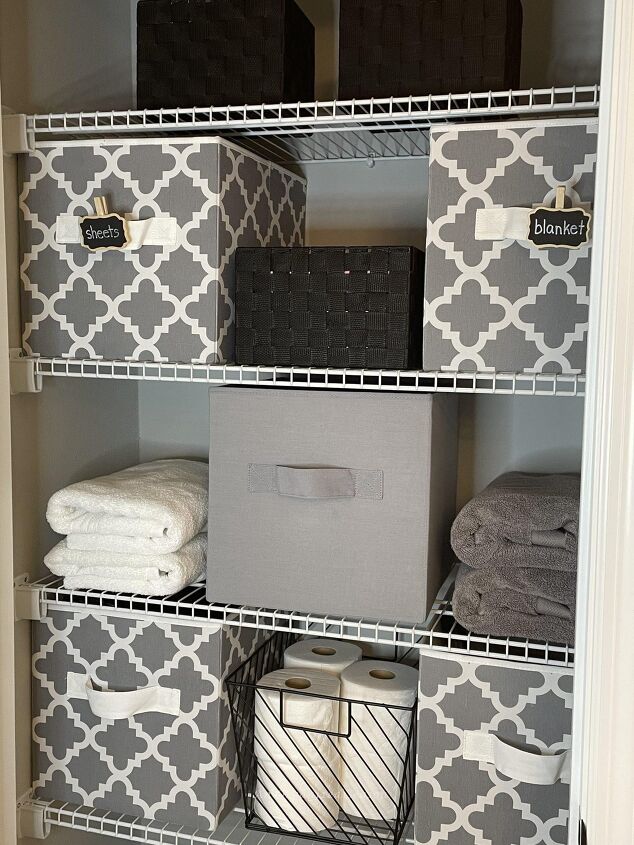 15 awesome storage solutions for your bathroom, Fabric cubes storing items in an organized bathroom closet