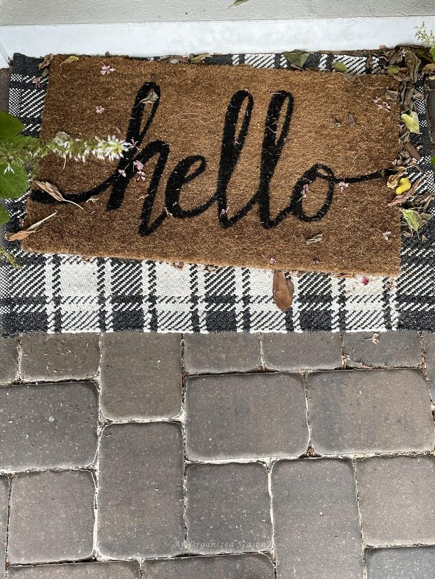 budget decorating ideas for an amazing fall porch, Welcome mat on front porch covered with leaves