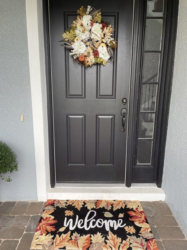 budget decorating ideas for an amazing fall porch, Front door with a matching Fall wreath and welcome mat