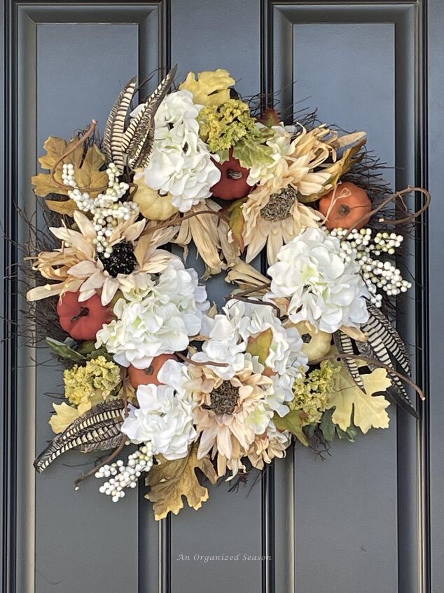 budget decorating ideas for an amazing fall porch, A fall wreath hanging on a door It was upcycled for a Budget decorating ideas for fall porch