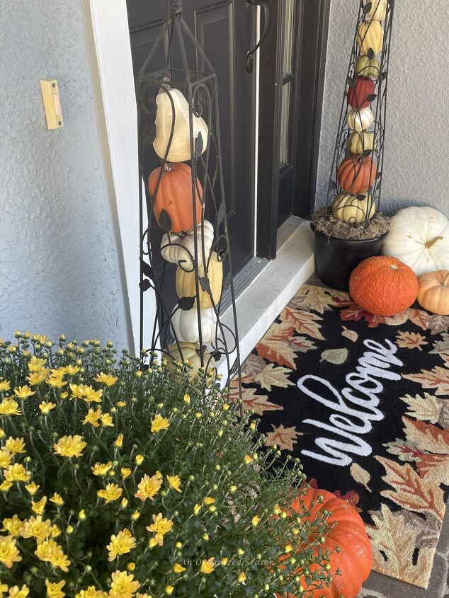 budget decorating ideas for an amazing fall porch, A front door rug that says welcome