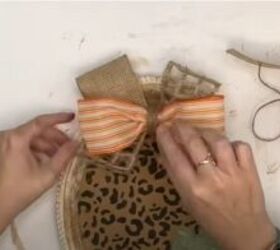 how to use dollar tree faux leather items in diy fall decor, Adding a bow to the platter