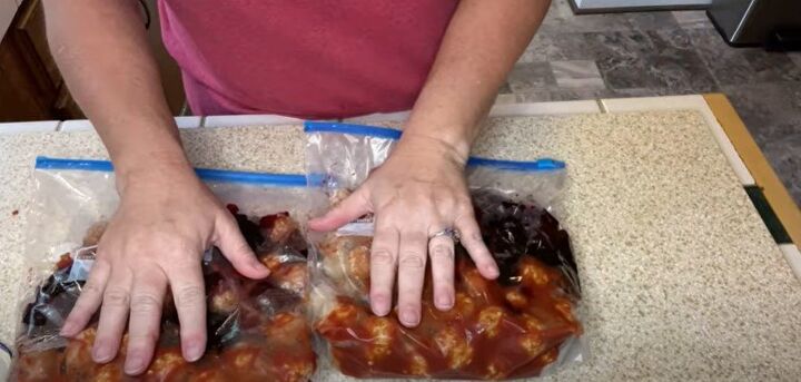 4 easy freezer meal prep ideas for quick simple dinners, Adding grape jelly to the freezer bags