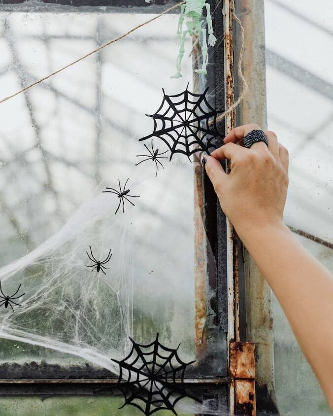 best ways to save money on halloween, decorating the door with spiders