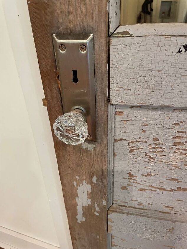 architectural salvage decorating ideas, glass doorknob on an old panel door
