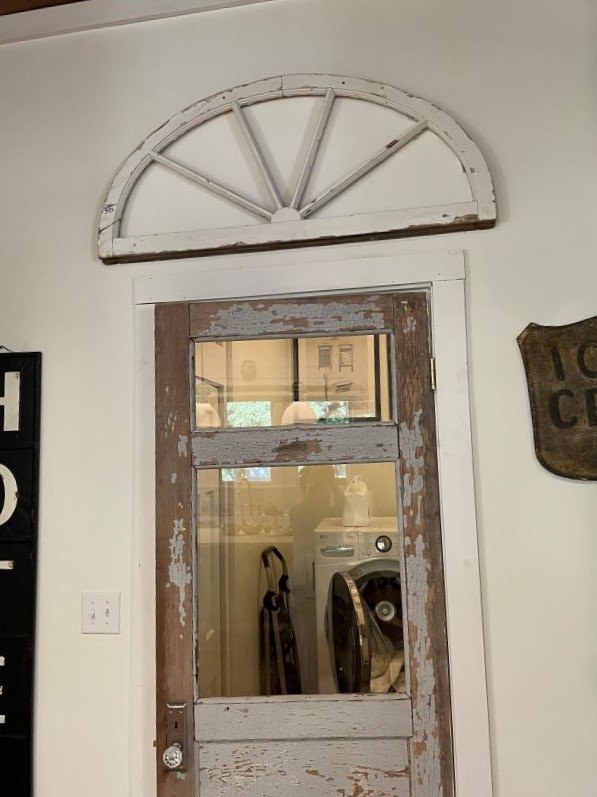 architectural salvage decorating ideas, Old wooden window without glass displayed over an old door