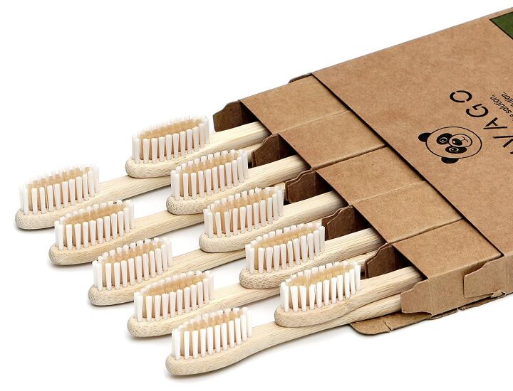 zero waste bathroom tips, Bamboo toothbrushes laying down poking out of the box