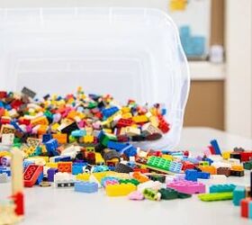 how to save money on toys, a bin of Legos tipped over