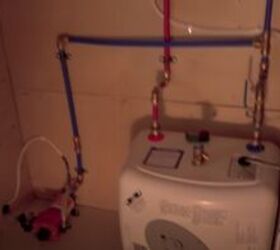 take a look inside this cute cozy diy family skoolie, Water pump and water heater on a skoolie