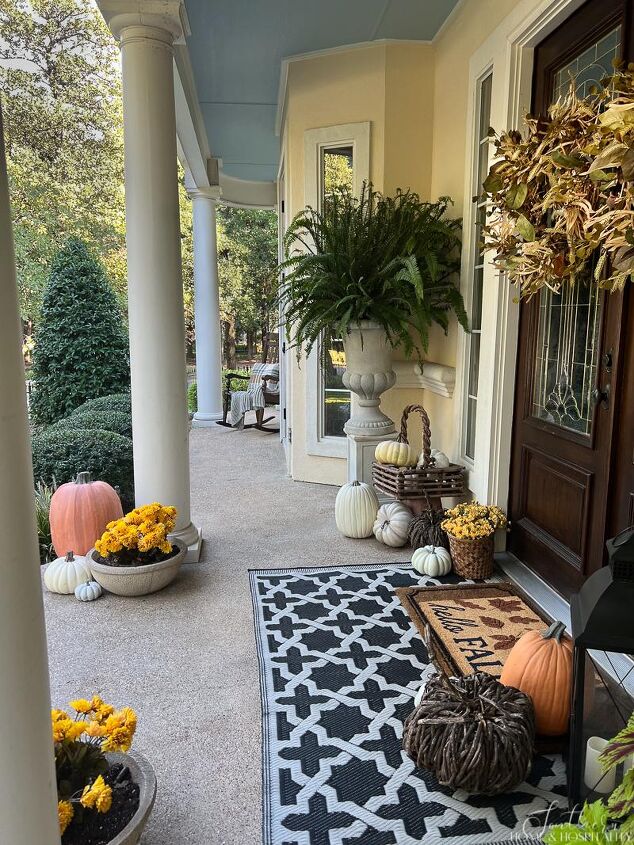 easy fall front porch ideas that won t break the bank, Front porch decorated with pumpkins and mums for fall