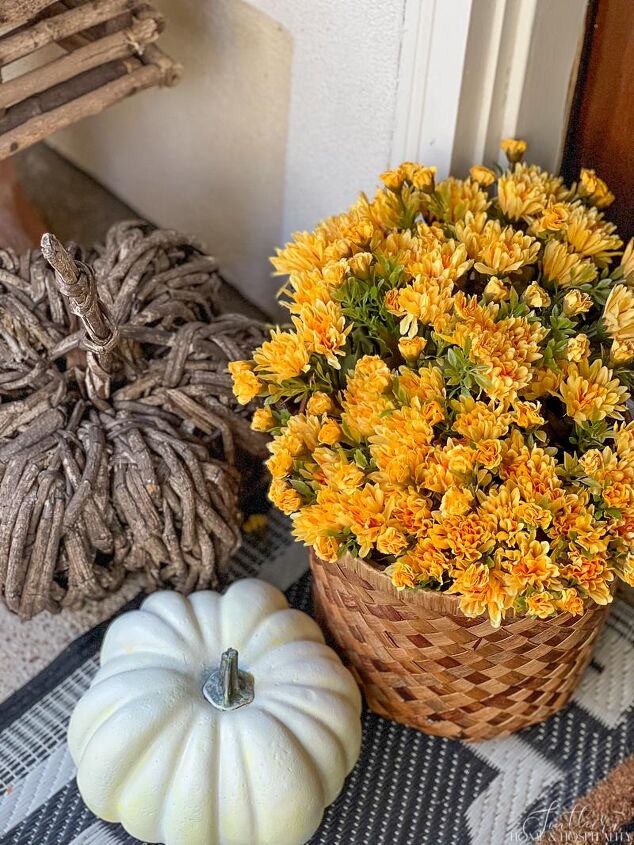 easy fall front porch ideas that won t break the bank, Yellow artificial mum white pumpkin grapevine pumpkin