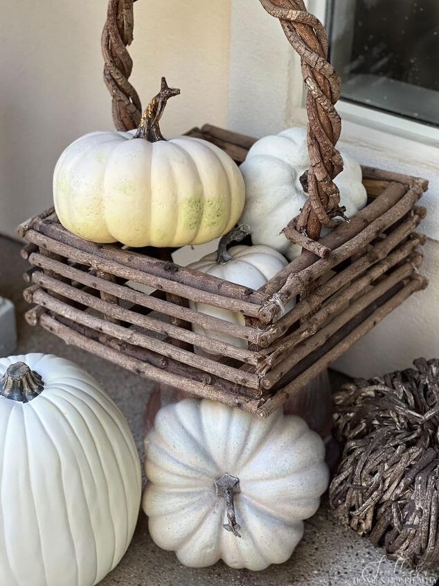 easy fall front porch ideas that won t break the bank, Twig basket of white pumpkins