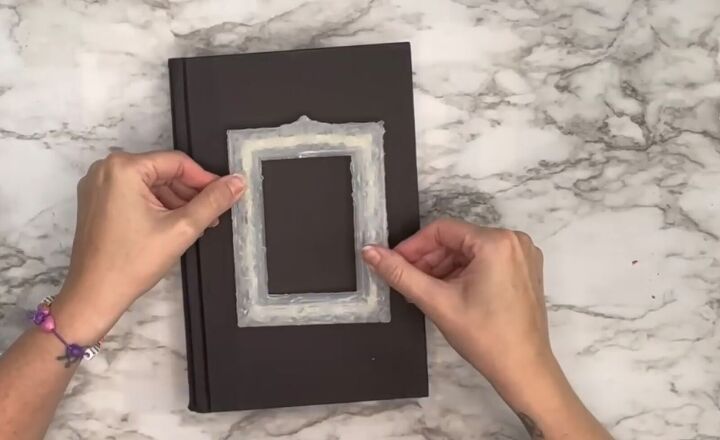 6 cute diy book decor ideas using books from dollar tree, Placing the mold on the book