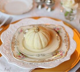 fall wedding ideas on a budget, mini pumpkins on gold and cream colored plates