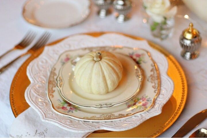 fall wedding ideas on a budget, mini pumpkins on gold and cream colored plates