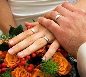 fall wedding ideas on a budget, a man and woman holding hands over a bouquet