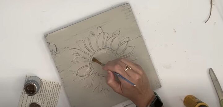 4 creative ways to use dollar tree caulk to make decor, Painting inside the sunflower