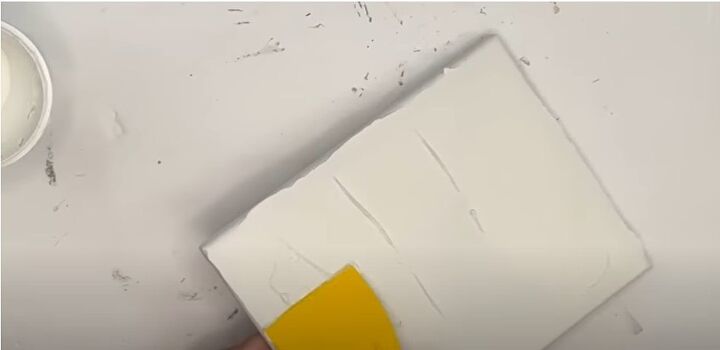 4 creative ways to use dollar tree caulk to make decor, Smoothing out the spackle