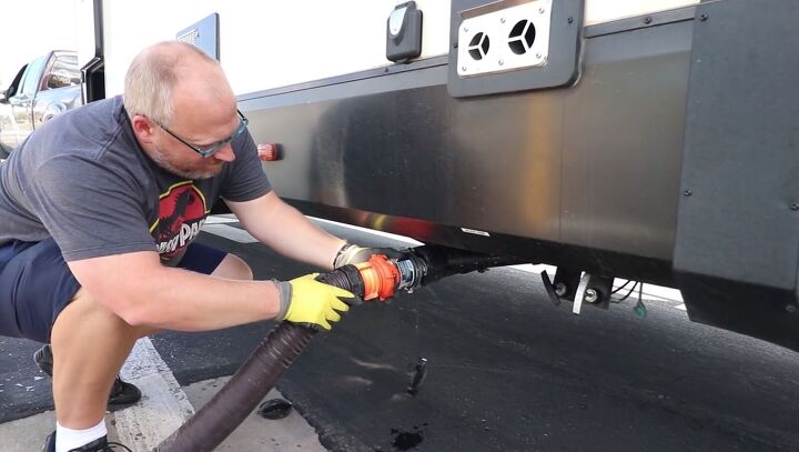 how to use an rv dump station an easy step by step guide, Attaching the hose to the RV