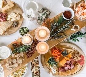 holiday entertaining on a budget, photo of a charcuterie table with cheese crackers nuts olive shrimp and more to entertain on a budget