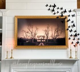 5 ways to celebrate christmas on a budget, close up of my frame tv with halloween art from Etsy and black butterflies from Amazon