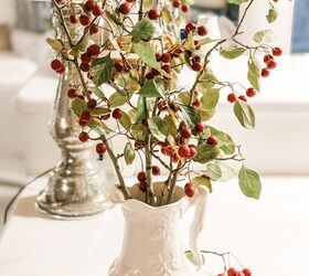 5 ways to celebrate christmas on a budget, pitcher with branches and berries that I found in my yard for a way to celebrate christmas on a budget