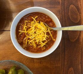 5 ways to celebrate christmas on a budget, chili topped with cheese for a budget friendly holiday party