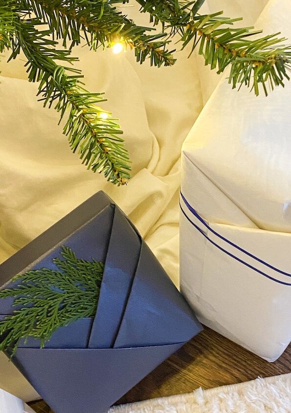 using kraft paper for inexpensive gift wrap, top view of gifts wrapped in blue and white Kraft paper inexpensive way to wrap gifts