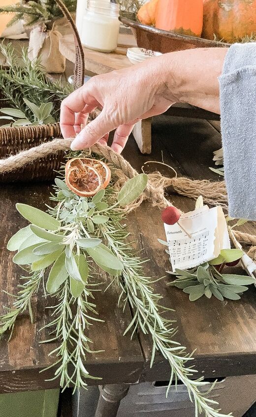 how to use greenery for christmas diy projects, Fresh Herb and Dried Fruit Christmas Garland