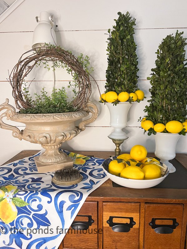 how to use greenery for christmas diy projects, Boxwood and Lemon Topiaries