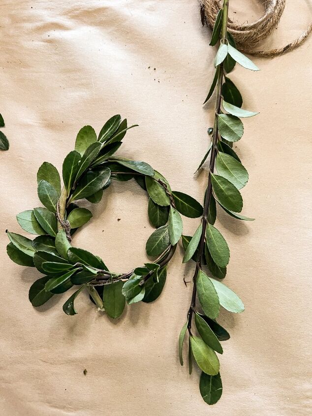 how to use greenery for christmas diy projects, Twist Christmas Boxwood Around the floral wire twice for a full wreath