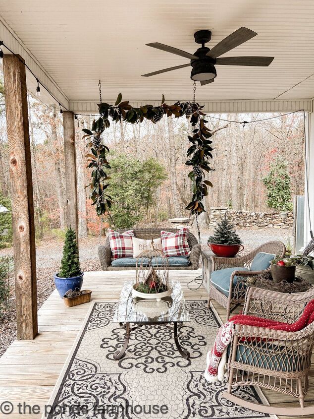 how to use greenery for christmas diy projects, Magnolia Garland on Front Porch Swing Greenery for Christmas