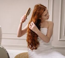 home remedies for split ends, a woman in a towel brushing her hair