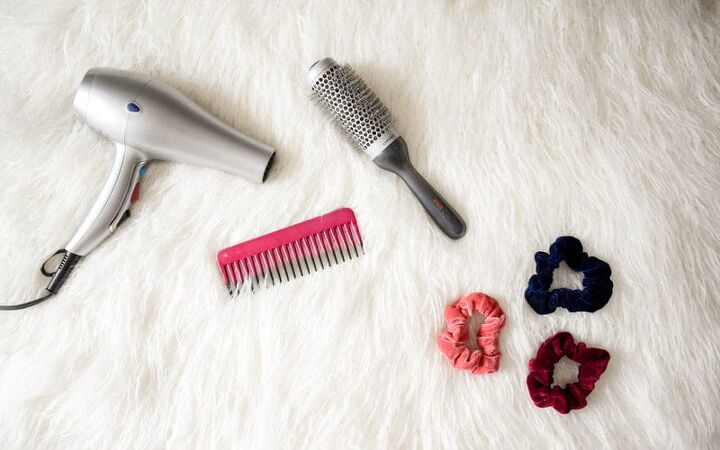 home remedies for split ends, blow dryer and styling tools on a white rug