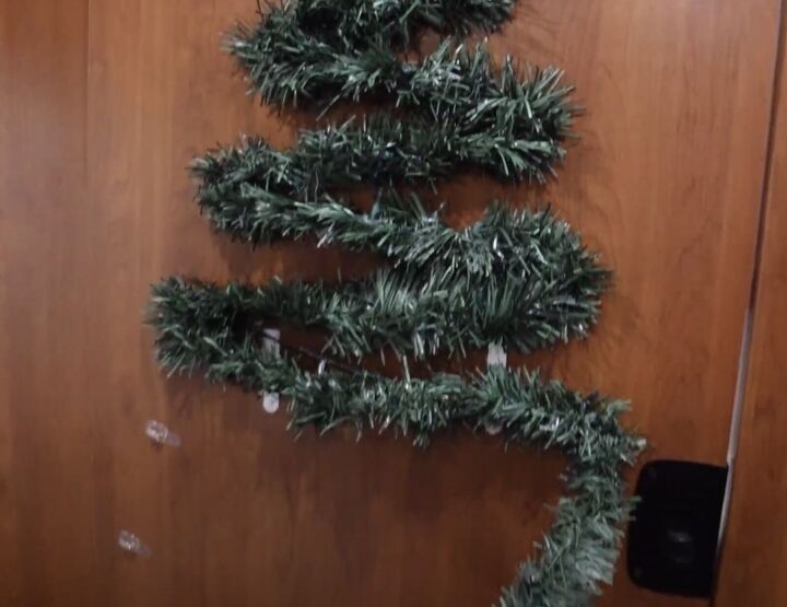 super easy rv christmas tree hack cute festive decor, Attaching the garland and lights