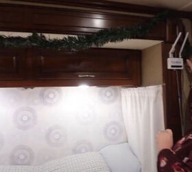 super easy rv christmas tree hack cute festive decor, Hanging a garland over the bed