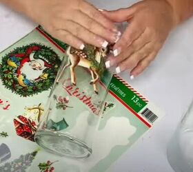 8 festive dollar tree christmas diys craft projects, Adhering the window clings to a glass