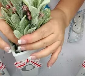 8 festive dollar tree christmas diys craft projects, Adding greenery to the vases