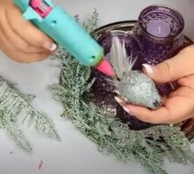 8 festive dollar tree christmas diys craft projects, Hot glueing the greenery to the tray